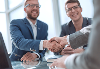 Business People Shaking Hands After Making a Sell